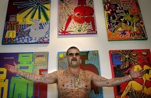 Mark Brandon Chopper  Reid, with some of his works on exhibition at the Michael Boyd Gallery , Collingwood in 2006.