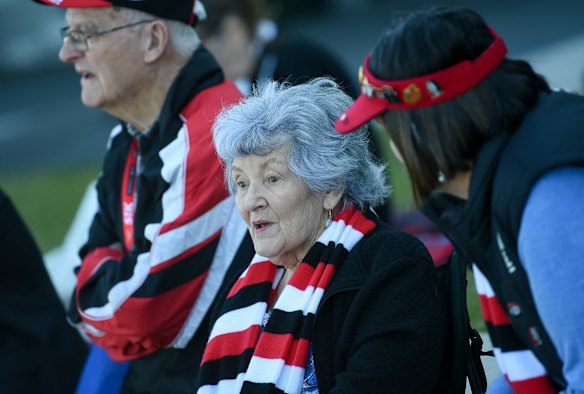 Fan Judy Harley watches the broadcast of Danny Frawley's service at RSEA Park.