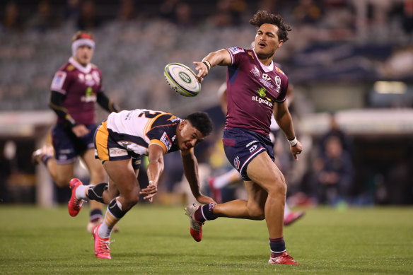 Jordan Petaia offloads in the Super Rugby AU grand final last weekend.