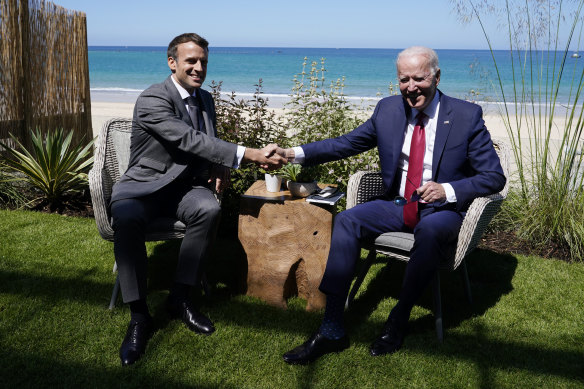 President Joe Biden and French President Emmanuel Macron visit during a bilateral meeting at the G-7 summit.