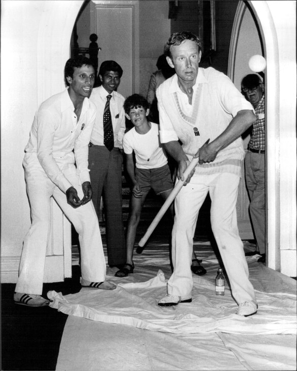 A 10-year-old James Packer playing cricket inside the RAS members building at the old showground when rain stopped play, with players Derek Underwood and Asif Iqbal Fairfax Media.