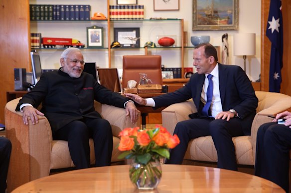 Prime Minister Tony Abbott and Indian Prime Minister Narendra Modi talk within the Prime Minister's suite at Parliament House in Canberra on Tuesday 18 November 2014. 