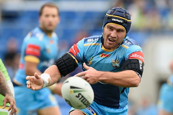 Nathan Friend of the Titans passes the ball.