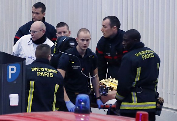 Police, paramedics and firefighters at the scene of the shooting in the south Paris on Thursday, January 8. 