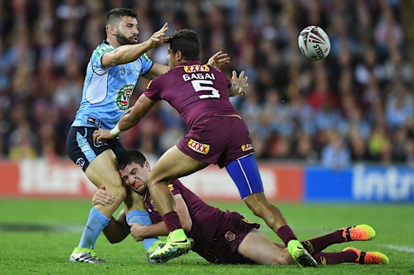 Josh Mansour of the Blues offloads the ball