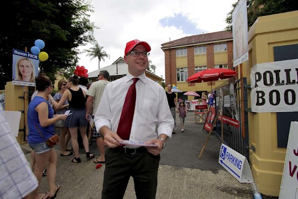 Labor's Andrew Fraser handing out how to vote cards at Milton State School. Photo: Michelle Smith