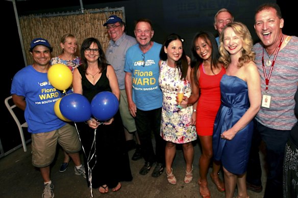 LNP supporters at South Brisbane candidate Fiona Ward's election party watch the election results. 