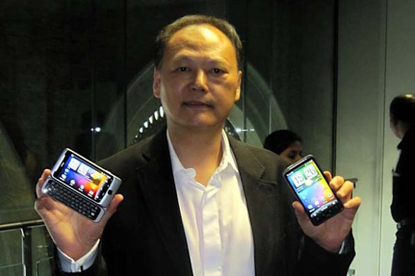 HTC CEO Peter Chou holds up his new babies.