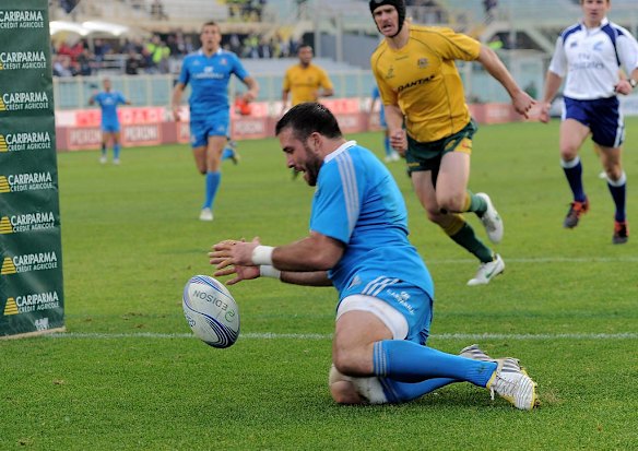 Robert Barbieri of Italy scores a try.