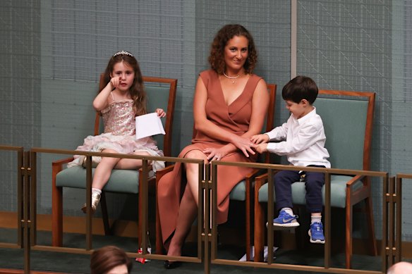 Amie Frydenberg with children Gemma and Blake as Treasurer Josh Frydenberg delivers the budget in the House of Representatives on Tuesday night.