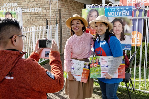 Independent candidate Dai Le (left), campaigning in St Johns Park. 