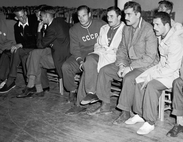 A group of Russian athletes sit out a dance at the Olympic Village during the 1956 Melbourne Olympics on December 1, 1956.