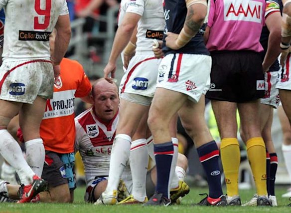 The Dragons Michael Weyman lies dazed on the ground after receiving a late shot to the head.