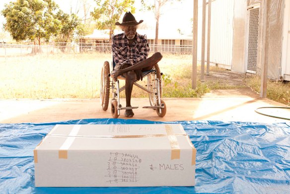 July 19th 2011, Kakadu traditional owner Jacob Nayinggul oversees the first box of bones at the start of the ceremonial preparation as human remainsare finally reurned to their ancestral home in Gunbalanya for ceremonial reburial after over 60 years in the posession of the Smithsonian Institution after being collected during a combined Australian and American expedition to Arnhem Land in 1948.  Photo Glenn Campbell