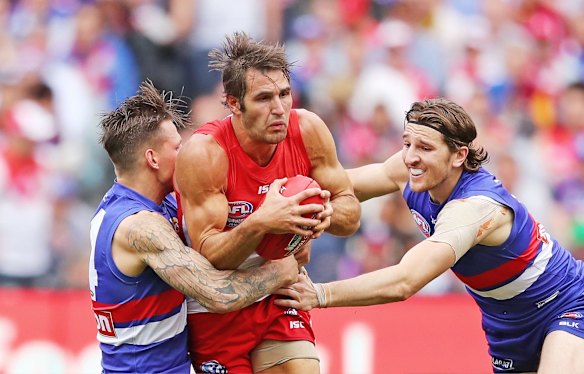 Josh Kennedy of the Swans is tackled during the 2016 Toyota AFL Grand Final match.