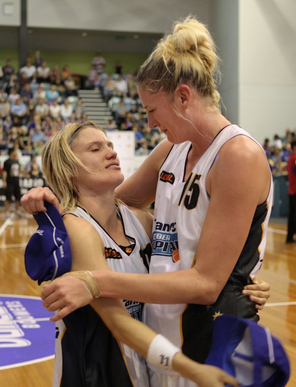 Canberra Capitals players Jess Bibby and Lauren Jackson after winning the 2010 WNBL grand final.