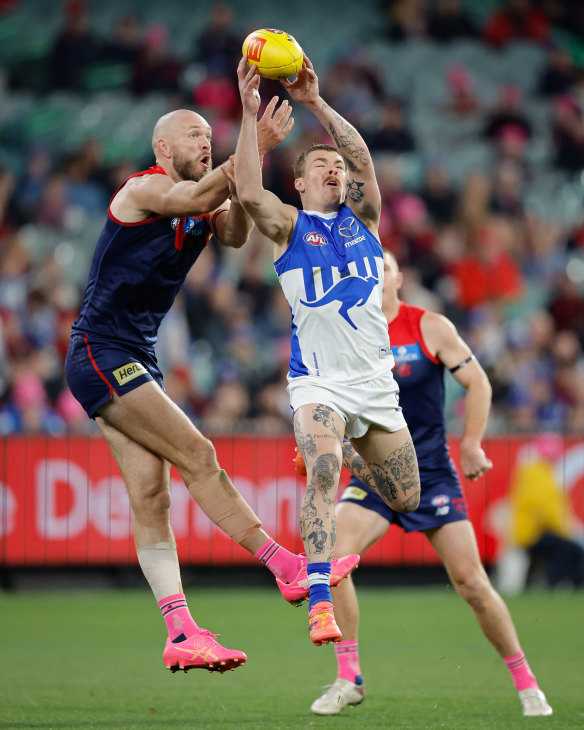 Max Gawn of the Demons and Cameron Zurhaar of the Kangaroos compete for the ball.