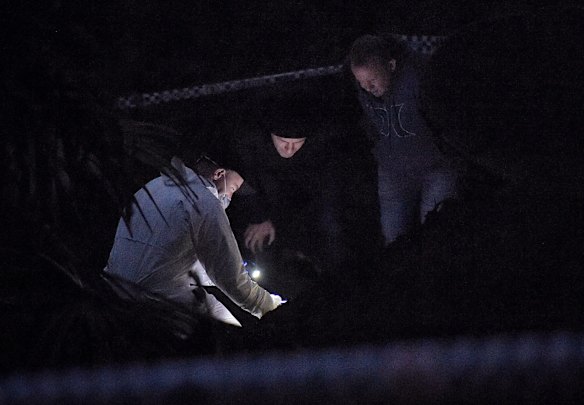 Wednesday's operation was moments from wrapping up before the skeletal remains were uncovered 100 metres from Mckell Avenue. Pictured are a NSW Police Forensic Services officer (left) and Detective Chief Inspector Gary Jubelin (2nd from left) at the crime scene where human remains have been unearthed.