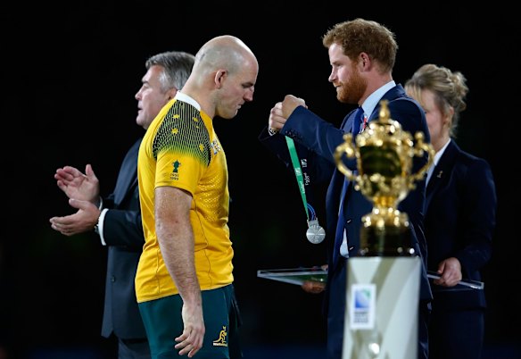 Gracious:  Prince Harry presents Stephen Moore with his medal.