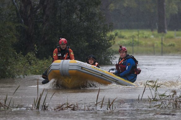 Lansvale resident Nancy Streeta is evacuated by the NSW SES Kogarah Unit.