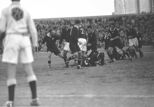 Players contest the ball during a ruck.
