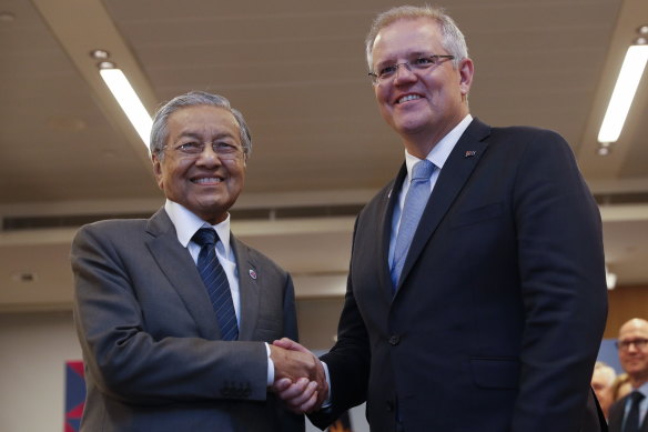 Malaysian Prime Minister Mahathir Mohamad shakes hands with Prime Minister Scott Morrison during Thursday's bilateral meeting.