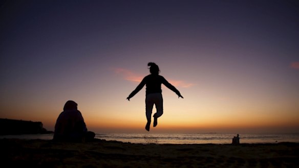 Asiyah Aziz, 8 from Yagoona, and her mum Zarina, left enjoy the early morning light.