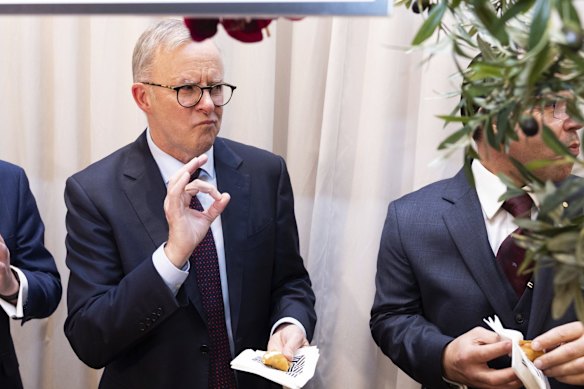 Opposition Leader Anthony Albanese eats a cannoli during a community event at Club Marconi in Bossley Park, NSW.