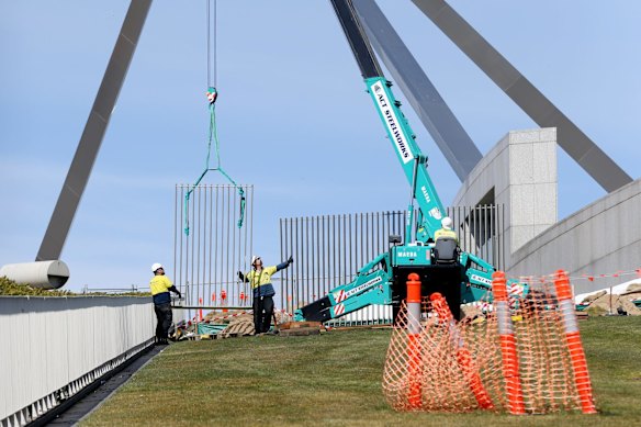 A security fence is installed across the lawns of Parliament House in Canberra on Tuesday 12 September 2017. 