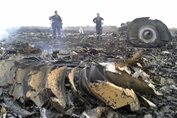 Emergencies Ministry members work at the site of a Malaysia Airlines Boeing 777 plane crash.