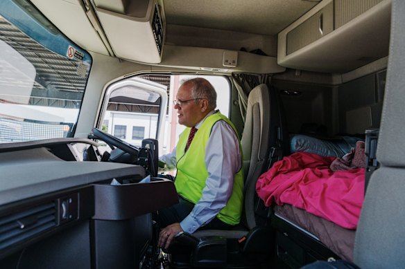 Driver's seat: Morrison jumps into a truck cabin at  John West Logistics in Brisbane where he announced a program for truck driving apprenticeships. 