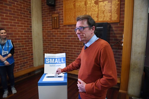 Independent candidate Dr Joe McGirr casts his vote at South Wagga Primary School.