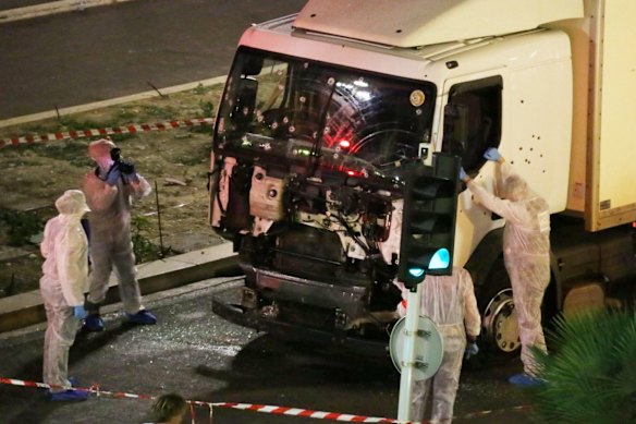 Authorities investigate a truck after it plowed through Bastille Day revelers in the French resort city of Nice, France.