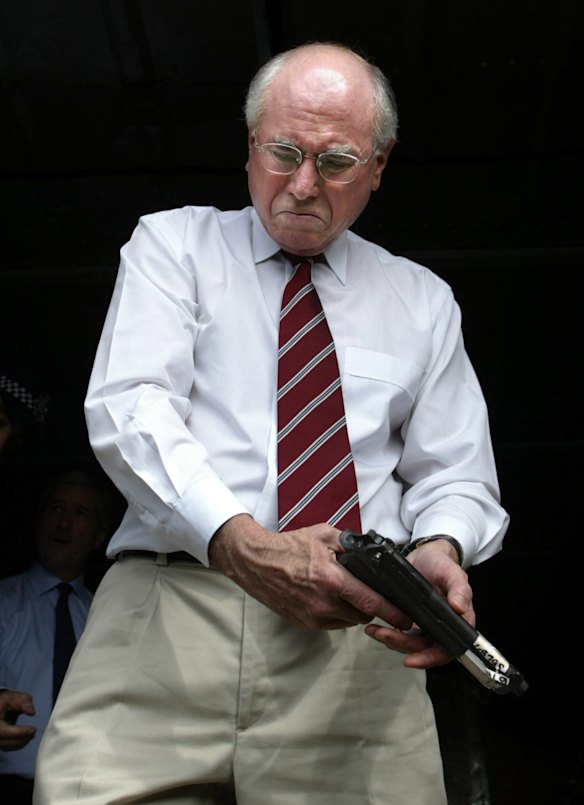Prime Minister John Howard on his one day visit to the Solomon Islands inspecting some guns that were handed in. The intervention force collected more than three thousand weapons during the gun amnesty. 25th August 2003.