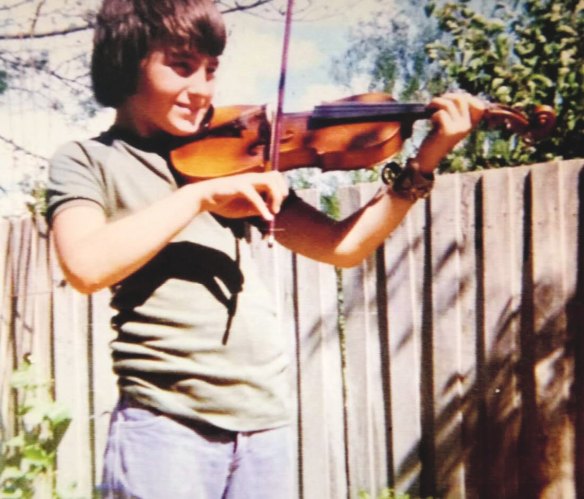 Warren Ellis at age 12, with his violin.