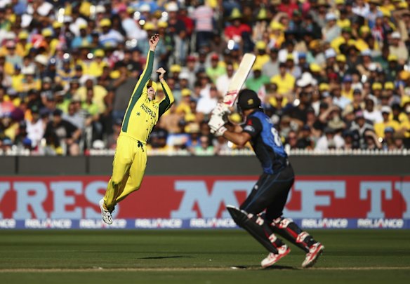 Steve Smith leaps high in an attempt to take a catch off Grant Elliott.