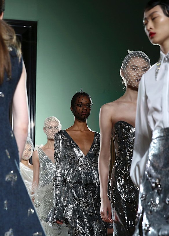 Models wear creations by Erdem at the Autumn/Winter 2018 runway show in London.