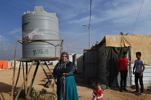 Samiha al-Kelani (left) from Ghouta infront of her home in Zaatari Camp in Jordan. Samiha and her family fled Syria in January, 2014.