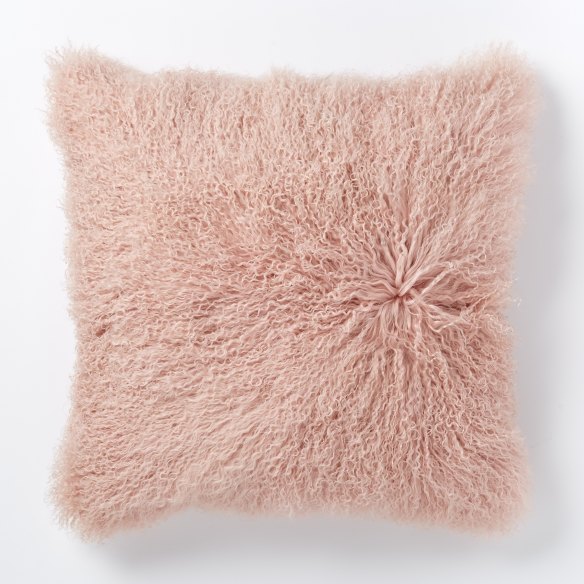 A TOUCH OF BLUSH
Mongolian Lamb Cushion Cover in Rosette. 
$199, 61cm, www.westelm.com.au