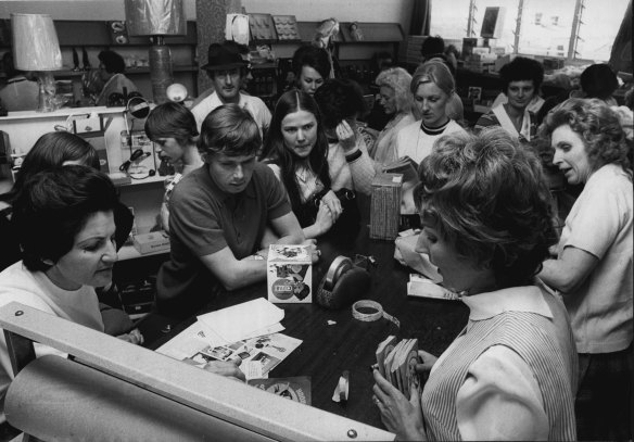“People exchanging their trading stamps at the Tiki Green Stamp office this afternoon.” November 16, 1971