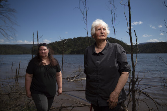 Traditional owners Aunty Sharyn Halls (right) with Kazan Brown stand beside Lake Burragorang in Sydney's Special Areas. Lake levels will rise as much as 17 metres if the height of the Warragamba Dam wall is raised, consigning hundreds of Indigenous sites to destruction during a big rain event.