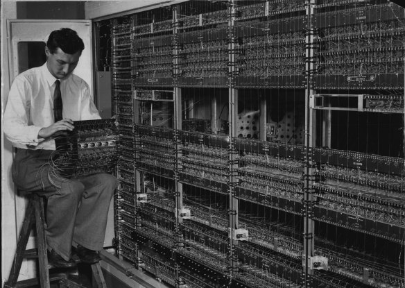 Maintenance engineer Peter Alpin is shown assembling the calculator on February 17, 1956. 
