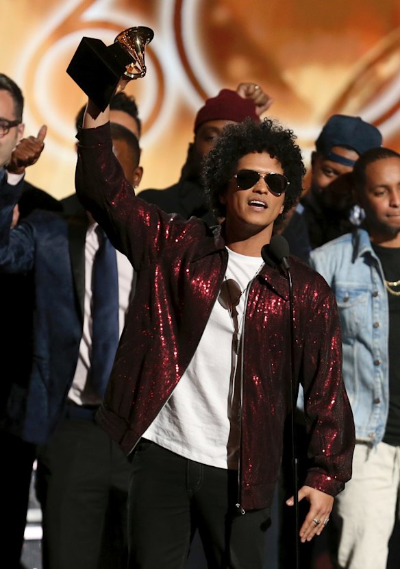 Bruno Mars accepts the award for album of the year for <i>24K Magic</i> at the 60th annual Grammy Awards.