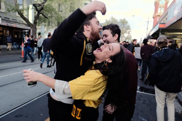 Richmond supporters celebrating their teams win over Adelaide during the AFL Grand Finals in Swan st Richmond.  Photo Luis Enrique Ascui