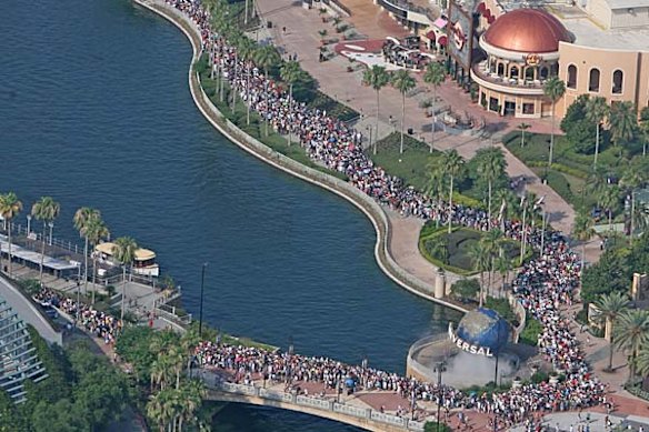 Thousands of people line up for the grand opening of the Wizarding World of Harry Potter at Universal's Islands of Adventure in Orlando, Florida.