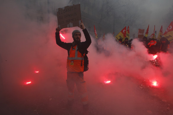 A protester holds up a poster during a demonstration in Paris on Thursday.