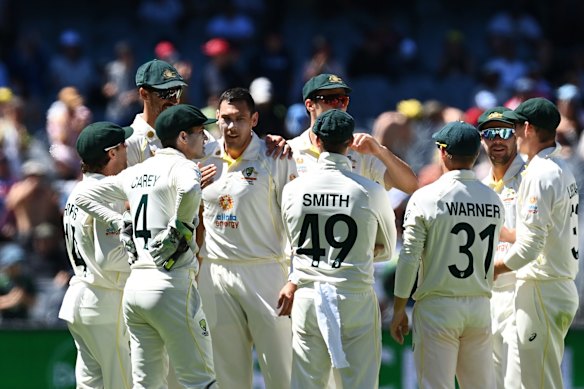 Scott Boland (4L) of Australia celebrates with teammates while waiting for the DRS decision to dismiss Jonny Bairstow of England.