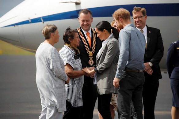 Prince Harry and Meghan, Duchess of Sussex are welcomed by officials.