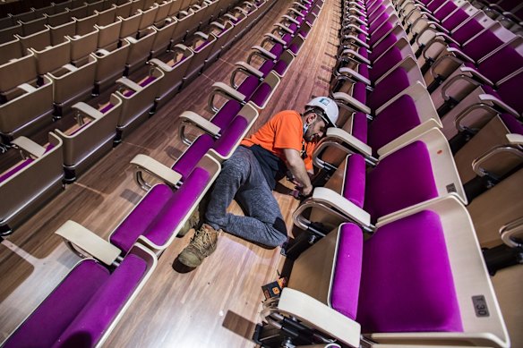 One of the around 4000 seats being installed by Joshua McKune.