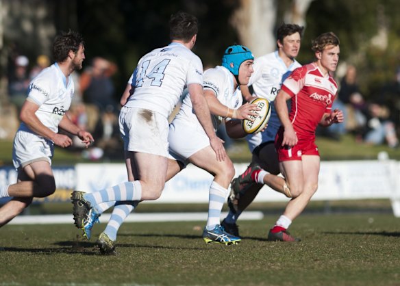 Queanbeyan's Dan Penca runs the ball.